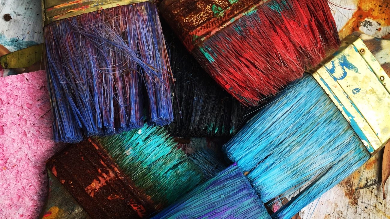Florida Artist RhondaK paintbrushes drying. She uses colorful paint in her works on mermaids, manatees, crabs, palm trees, and more. RhondaK.art
