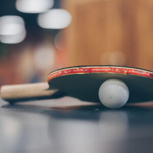 Selective focus photo of table tennis ball and ping pong racket
