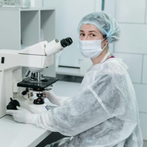 Scientist using a microscope in a laboratory