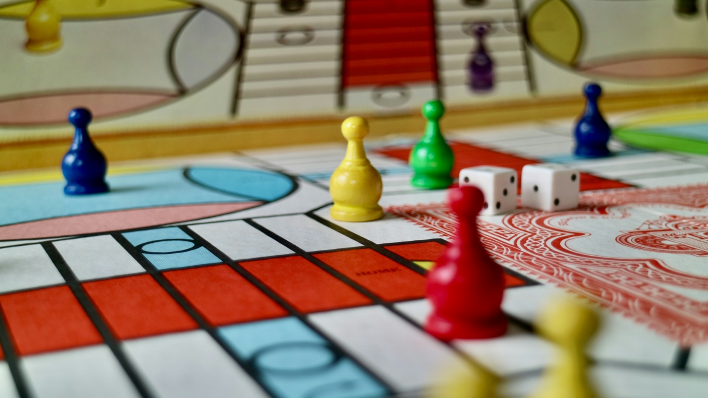 A game of parcheesi in progress featuring a vintage 1980s game set.