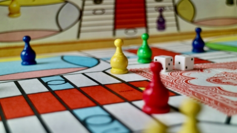 A game of parcheesi in progress featuring a vintage 1980s game set.